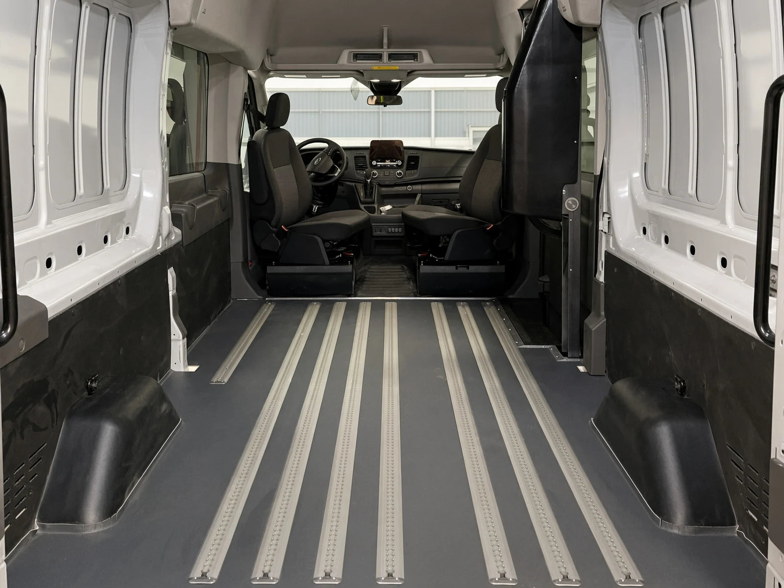 Track flooring inside a vehicle